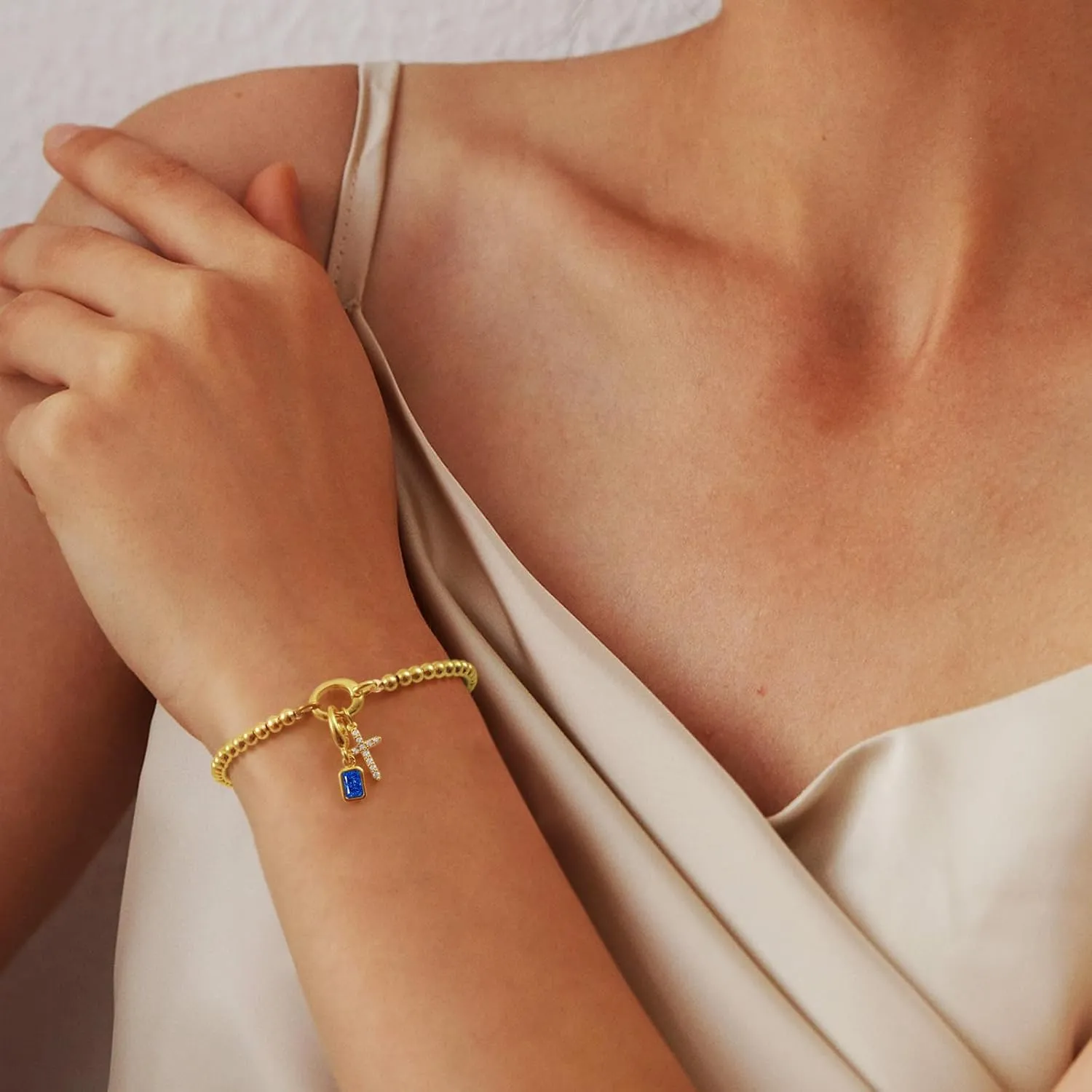 Free bird Cross Birthstone Bracelet | Dainty 14K Gold Plated Cross Charm Bracelet for Women | Stretchable Elastic Gold Beaded Bracelet | Stackable Trendy Birthstone Bracelet | Jewelry Gifts for Women