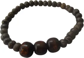 Handcrafted Wooden Beaded Bracelet featuring three mid-coffee colored large wooden beads. Designed with an adjustable nylon cord.Includes a complementary pair of matching earrings, featuring two small and one mid-sized wooden bead.